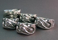 Photo of 5 Sterling Silver Wolf rings made by Walker Goldsmiths