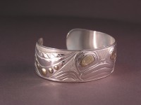 Photo of Sterling silver and 18Kt gold hand carved Frog bracelet