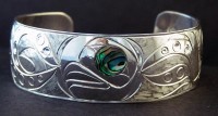Hand carved sterling silver baby octopus bracelet with abalone inlay