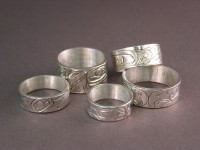 Collection of Handcarved Sterling Silver Northwest Totem Design Rings made by Owen Walker