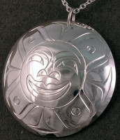 Hand carved sterling silver Sun mask pendant by Owen Walker