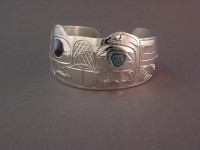 Photo of a sterling silver bracelet beaver design with abalone shell inlay