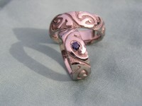 Photo of Walker Goldsmiths Polynesian Style Surfer Rings with dark blue Sapphire