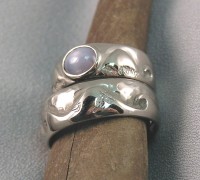 Photo of Walker Goldsmiths Surfer Rings with a Star Sappire
